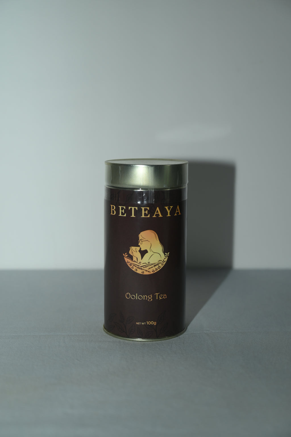 Cylindrical tea canister with 'Beteaya' branding on a light gray background