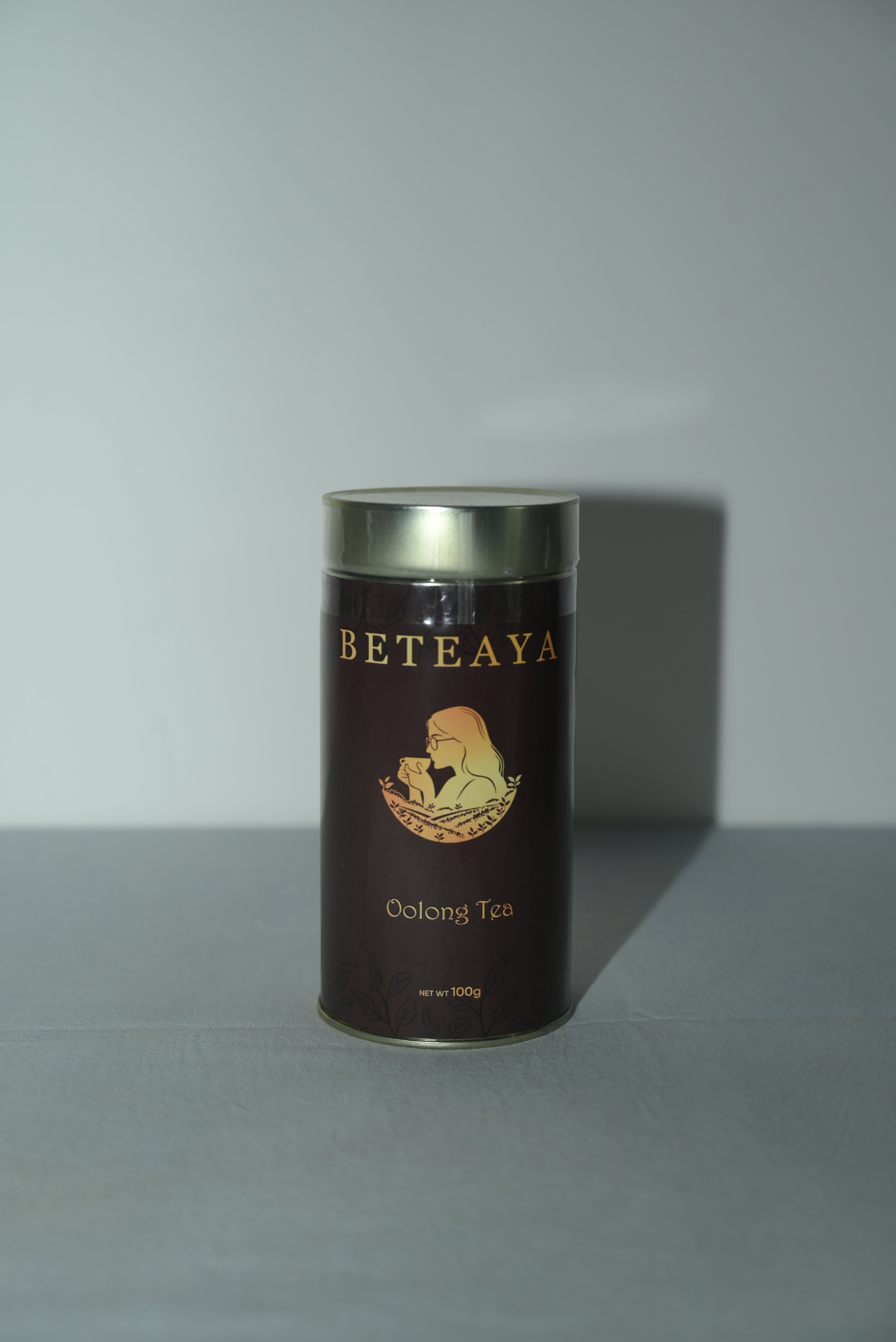 Cylindrical tea canister with 'Beteaya' branding on a light gray background