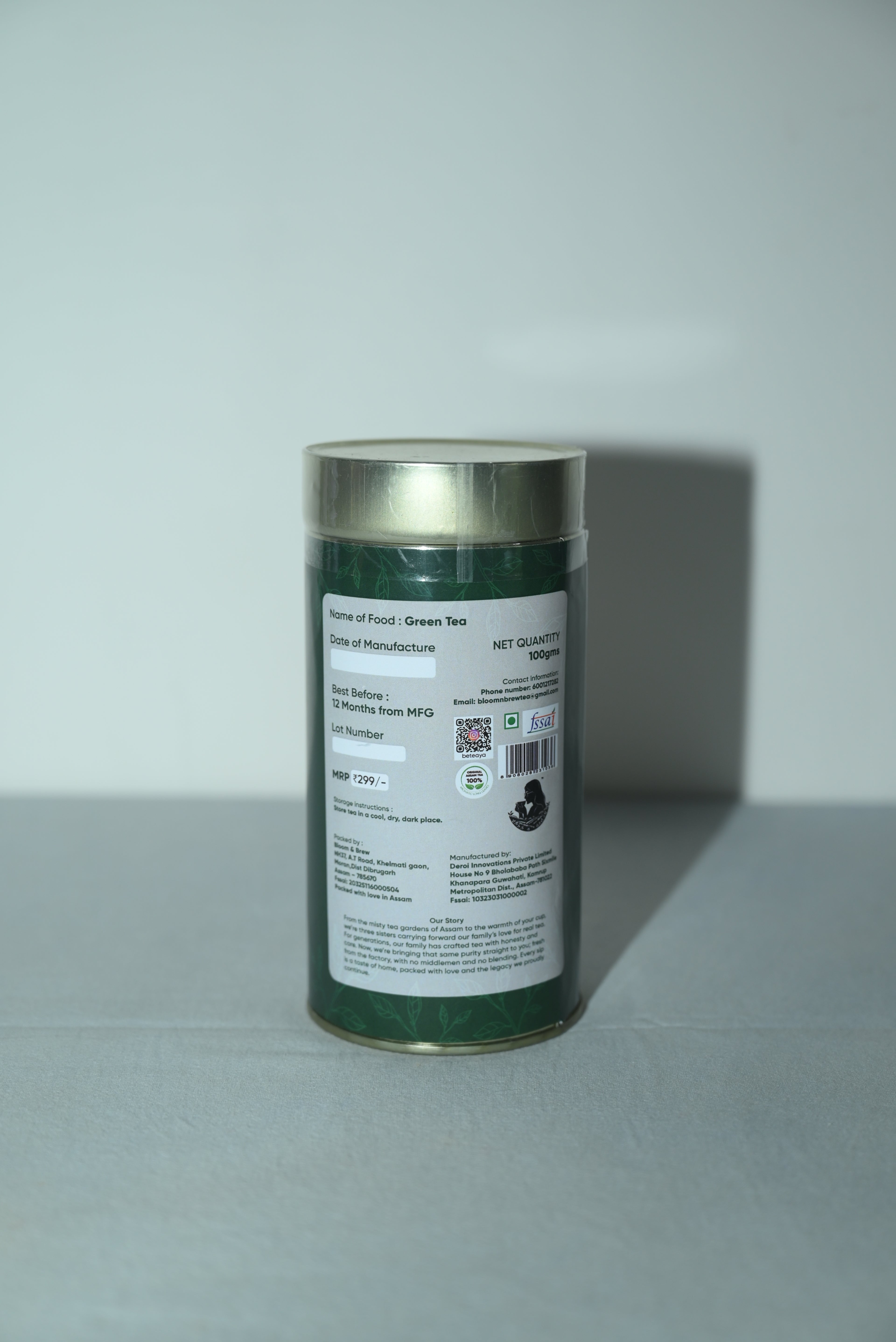 Green tea cylindrical container with label on a white background- beteaya