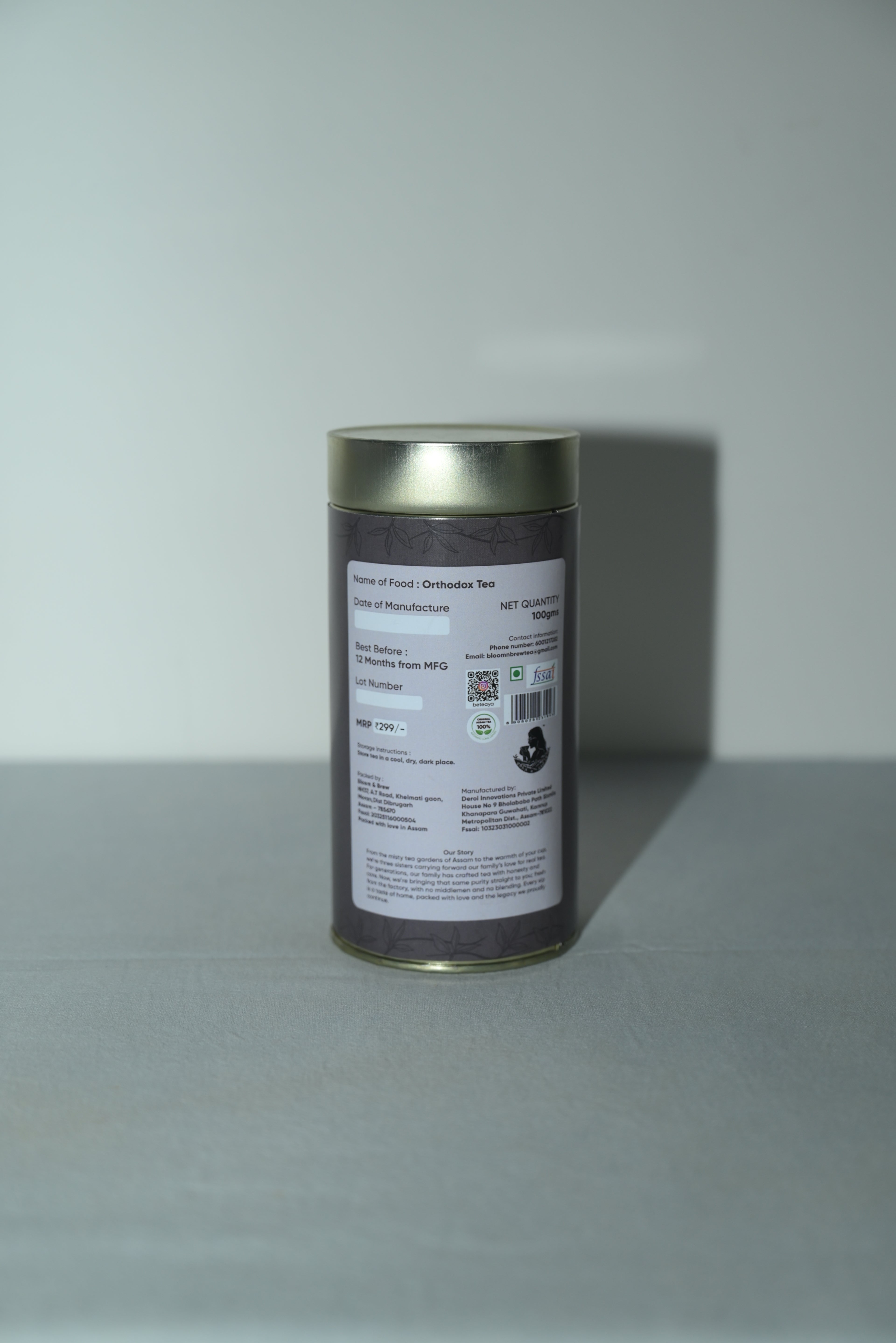 Cylindrical container with a label on a light gray background